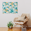 a room with a chair, potted plant and a painting on the wall
