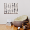 a living room with a bean bag chair next to a stack of books